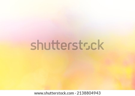 abstract and defocused background with pastel colors in shades of yellow, pink, green