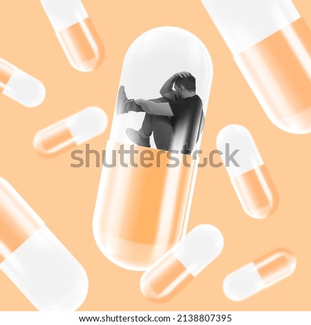 Doubts. Conceptual artwork. Desperate looking man sitting inside giant pill symbolizing depression and mental health problems. Male health care. Medical treatment. Concept of psychology, aid, medicine