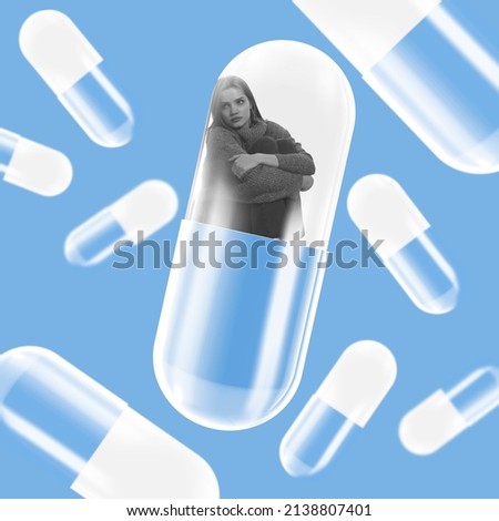 Loneliness. Contemporary art collage. Young depressed woman sitting inside giant pill isolated over blue background. Mental health care. Concept of treatment, pills, artwork, assistance