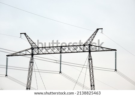 High voltage power line with insulation divider of electric power wires for safe delivering of electrical energy through steel cable on long distance