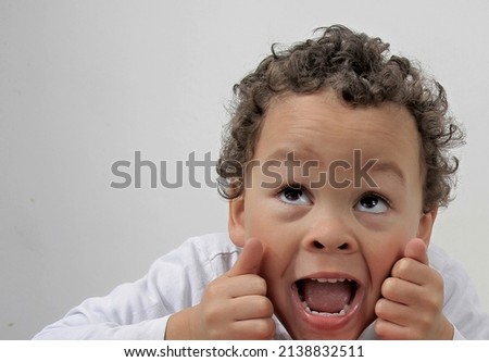 boy looking up to the sky on white background stock photo
