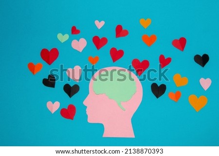 pink paper head and blue brain in it, around many colorful hearts, man in love and love of the air, head as copy space, flat design, human composition in love