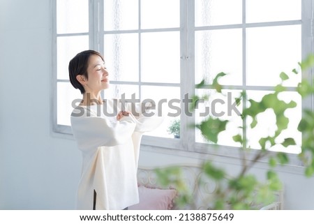 Asian woman with a smile Royalty-Free Stock Photo #2138875649