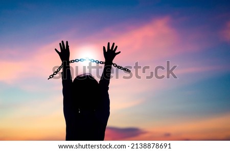 Silhouette kid with chain Freedom, Worship and Pray.Human rights.Child abuse.break chain power of prayer.Family and childhood.Pray faith hope.Forgive revival.Refugee African.Juneteenth day.kid child. Royalty-Free Stock Photo #2138878691