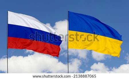 Flags of Russia and Ukraine on a Sky Background. Concept of a War Crisis.