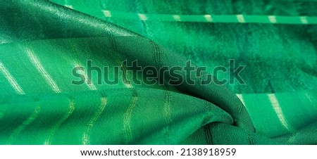 simple green fabric with lines. The lines formed by the extraction of the thread, Texture, background,