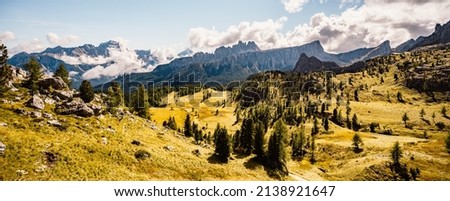 Majestic landscape of Alpine red autumn Cinque Torri, Passo Falzarego, Tofana. Wonderful hiking nature scenery in dolomite, italy near Cortina d'Ampezzo