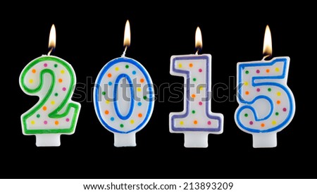 Burning candles on black background, number 2015, new year concept 