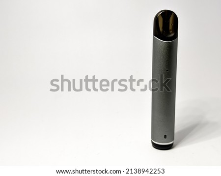 A silver vape pod or pod mod isolated on blurred white background