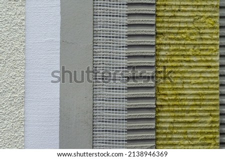 Close-up of external wall insulation systems and facade cladding. Royalty-Free Stock Photo #2138946369