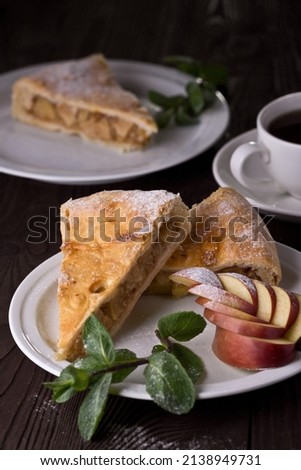 Apple pie with mint, sweetness. Food photography, dark background