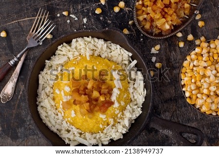 Corn porridge with cheese, Ukrainian village food. Food photography, top view