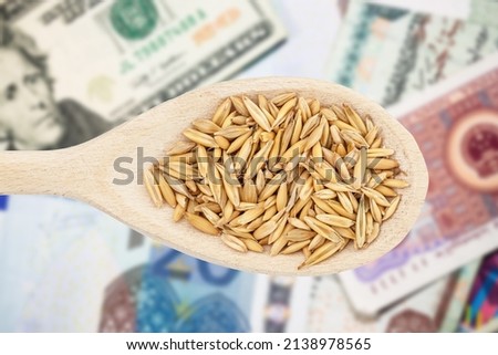 Oat price background. Upcoming food crisis. Wheat price raising. Food cost symbolic background. Agriculture industry grow. High price of grain. Stock food market business. Cereal grain texture. Royalty-Free Stock Photo #2138978565