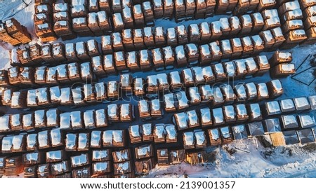 Pallets of bricks for construction. Outdoor storage in winter. Warehousing of large quantities of bricks. View from above