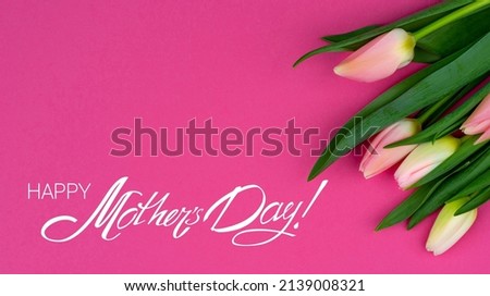Happy Mother's Day greeting card with a congratulatory calligraphic inscription on a bright floral background. A photo of flowers with lettering ready-made for congratulating your mom.