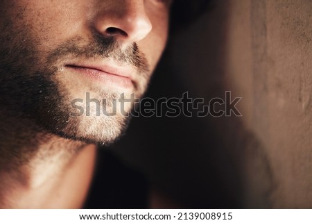 Hes got a chiselled jaw. Cropped image of the lower half of a handsome mans face. Royalty-Free Stock Photo #2139008915