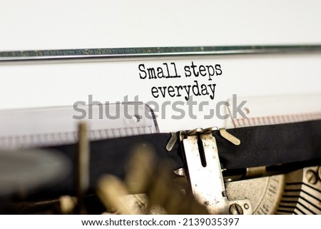Small steps everyday symbol. Concept words Small steps everyday typed on retro typewriter. Beautiful white background. Small steps everyday business concept. Copy space.