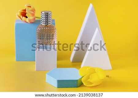 Abstract background for Branding and Minimal Presentation Perfume Bottle on Geometric Podium on Yellow Background Concept Shopping