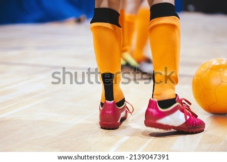 Indoor futsal soccer players playing futsal match. Indoor soccer sports hall. Futsal players kicking match. Futsal training dribbling drill. Sports background. Indoor soccer league Royalty-Free Stock Photo #2139047391
