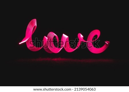 Pink light of love, air written at midnight