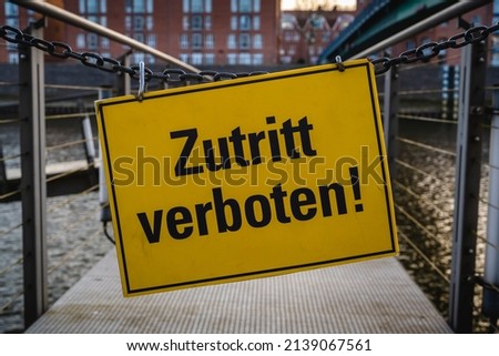 No entry information sign with black letters and yellow background