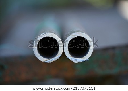 Metal pipe cutting. Cut metal pipe with a grinder. High resolution photo. 