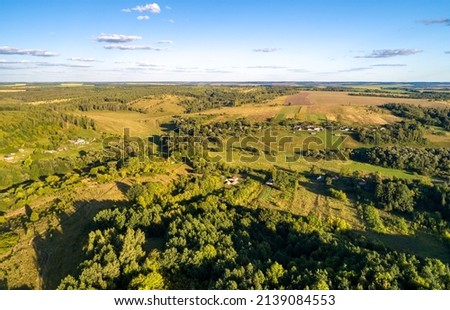 Aerial landscape of the Central Black Earth Region of Russia. Bolshoe Gorodkovo village, Kursk region, near the Ukrainian border Royalty-Free Stock Photo #2139084553