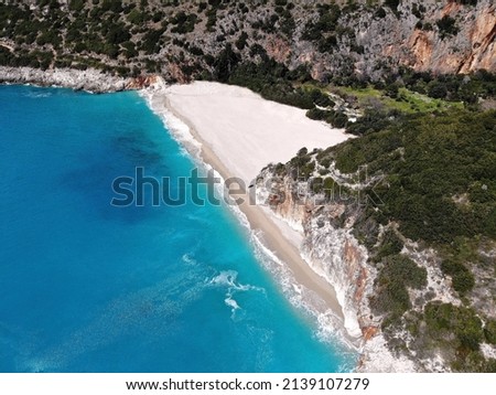 Drone picture of Plazhi I Gjipesë (Gjipe beach) in Albania. Private bay surrounded by tall rocky cliffs and green trees. Blue turquoise water of Albanias coast. Isolation summer vacation in paradise
