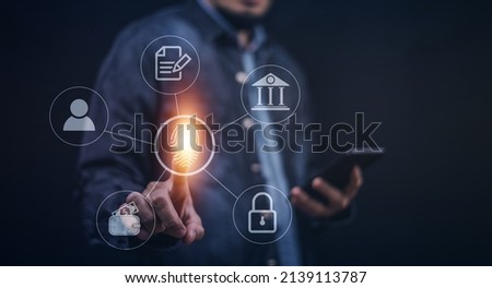 Businessman scans fingerprint to unlock security system Internet storage and financial systems Banking and personal information