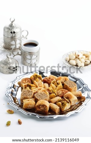 Mix Baklava Dish or Baklawa is Arabic and Turkish Traditional Sweets with Pistachio. Served with Turkish Coffee, Selected Focus Royalty-Free Stock Photo #2139116049