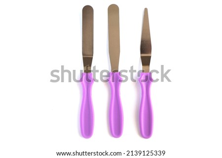 Professional Offset Spatula Set for icing large cakes quickly. starter kit for decorating a cake. Confectioner's tools isolate on white . pastry spatulas. High quality photo Royalty-Free Stock Photo #2139125339