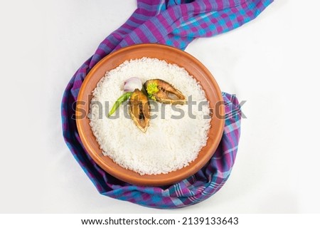 ilish panta Bengali new year festive dish. Boishakh panta ilish with green chilli and onion. Panta bhat is popular among Bengali's in India and Bangladesh. with gamcha. Royalty-Free Stock Photo #2139133643