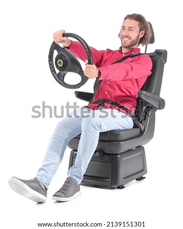 Man in car seat and with steering wheel isolated on white Royalty-Free Stock Photo #2139151301