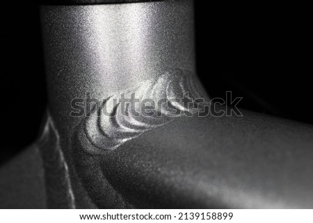 Welding seam of the aluminum frame of a sport bicycle Royalty-Free Stock Photo #2139158899