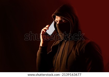 Cyber scammer calling by phone to deceive and steal confidential and banking data from his victims. Vishing alert Royalty-Free Stock Photo #2139163677