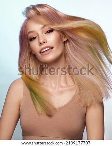 Beautiful woman with multi-colored hair and classic make up and hairstyle. Beauty face.