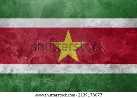 Textured photo of the flag of Suriname.