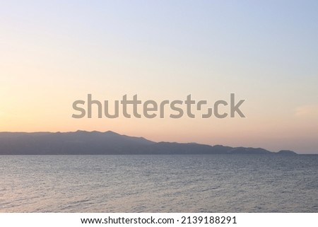Mediterranean sunset in Greece, Mountain View, plane is landing