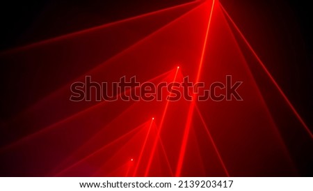 Interactive exposition in modern science museum or exhibition: laser show installation with red color rays or beams in dark room. Performance, technology, visuals, digital, contemporary art concept Royalty-Free Stock Photo #2139203417