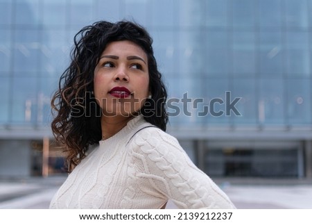 confident business woman looking up to the bright future of her career opportunities. Job, work aspirational banner panorama background. Businesspeople lifestyle Royalty-Free Stock Photo #2139212237