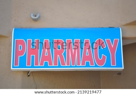 Pharmacy sign on the wall