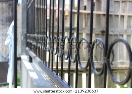 black fence with a ring shape