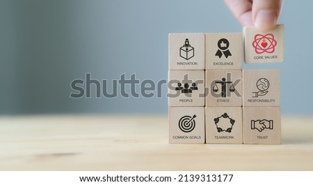 Core values,corporate values concept.  Company culture and strategy related to business and customer relationships, growth. Principles guide company's action. Put wooden cubes with core values icons. Royalty-Free Stock Photo #2139313177