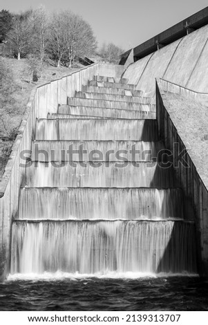 Long exposure of the waterfalls flowing over Wimbleball dam in Somerset