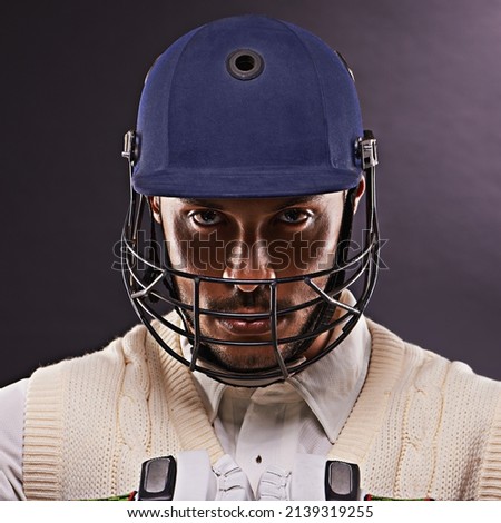 Confident in his batting ability. A cropped shot of an ethnic young man in cricket attire isolated on black.