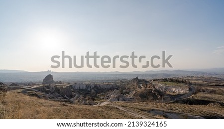A view of the valley in Cappadocia with mountain peaks in the summer day