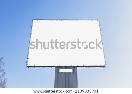 Mockup large white blank advertising billboard or promotion against the blue sky background
