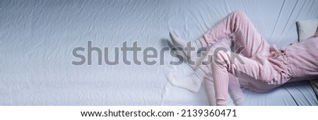 African American Woman With RLS - Restless Legs Syndrome. Sleeping In Bed Royalty-Free Stock Photo #2139360471