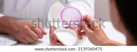 Gynecologist Consulting Woman On Diaphragm Contraception And Birth Control Method Royalty-Free Stock Photo #2139360475
