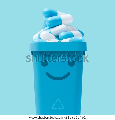 Smiling trash can full of expired pills, medical waste disposal concept
